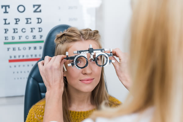 Young patient with trial frame in clinic